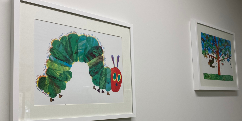 Photo of the Very Hungry Caterpillar framed on a wall